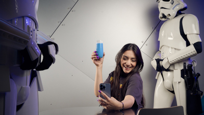 Woman poses for a selfie with blue milk.