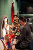 Parents and babies looking at exhibitions display