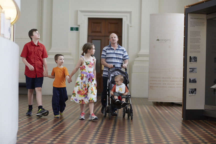 A family walking through Immigration Museum.