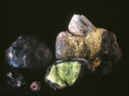 Augite (black rock on left) and Anorthoclase (brown rock at back right)