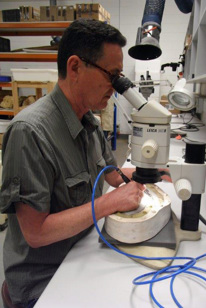 Man looking through a microscope