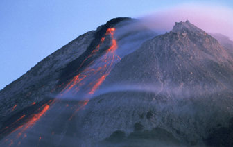 Lava streaming down the side of a volcano