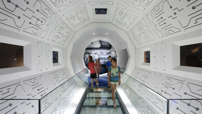 children in space ship installation