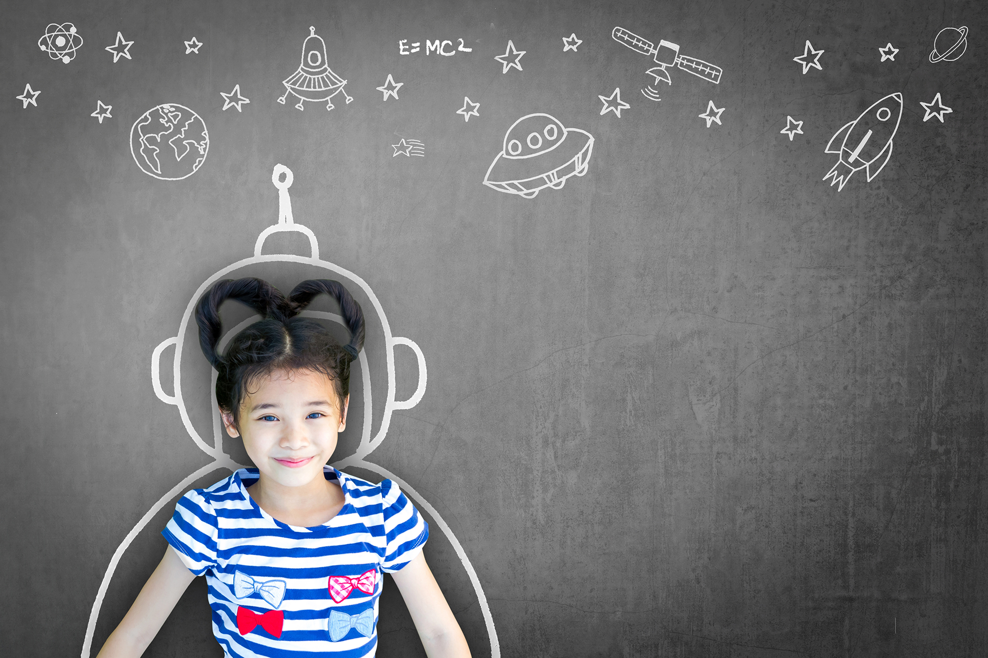 A girl posing amongst illustrations of spaceships and stars.