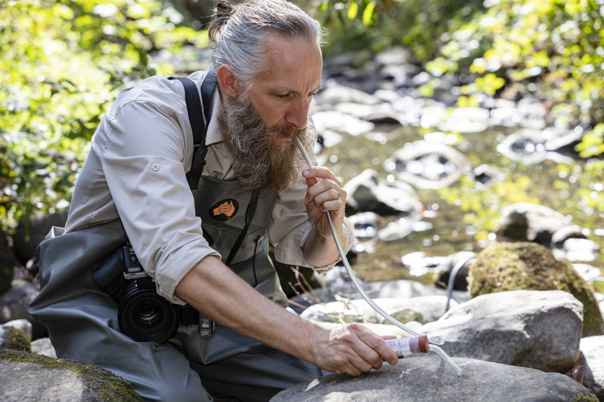 Curator Julian Finn photographing and collecting aquatic insects along the Wye River. Location: Australia, Victoria, Great Otway National Park, Wye River, At back of Wye River Big 4 Caravan Park, in river. Survey: Otways Bioscan OTB 2018 158