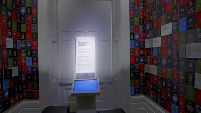 Various passports on wall and touchscreen in middle