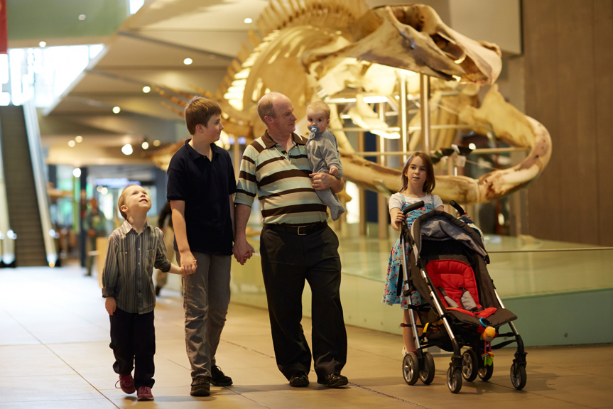 Family walking and Blue Whale skeleton