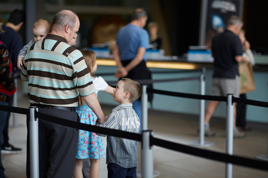 Man and boy in a queue