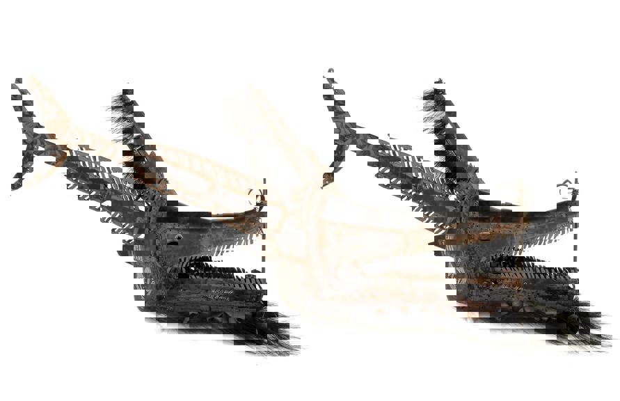 A headdress in the form of a crocodile with a fish tail. 