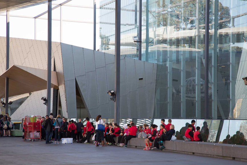 School students eating their lunch on the museum plaza