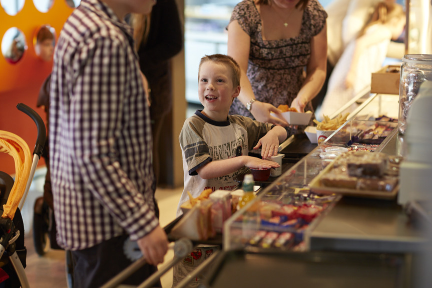 Boy and family lining up at the Scienceworks Cafe