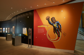 Entry signage for the Marramb-ik (I Am) exhibition of Koori comics and graphic novel artwork, in the Birrarung Gallery, Bunjilaka