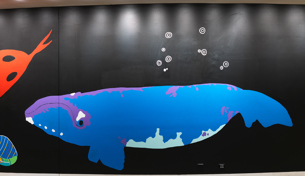 Section from the wall of the Birrarung Gallery featuring a 28 metre mural in honour of Victoria's 44 language groups