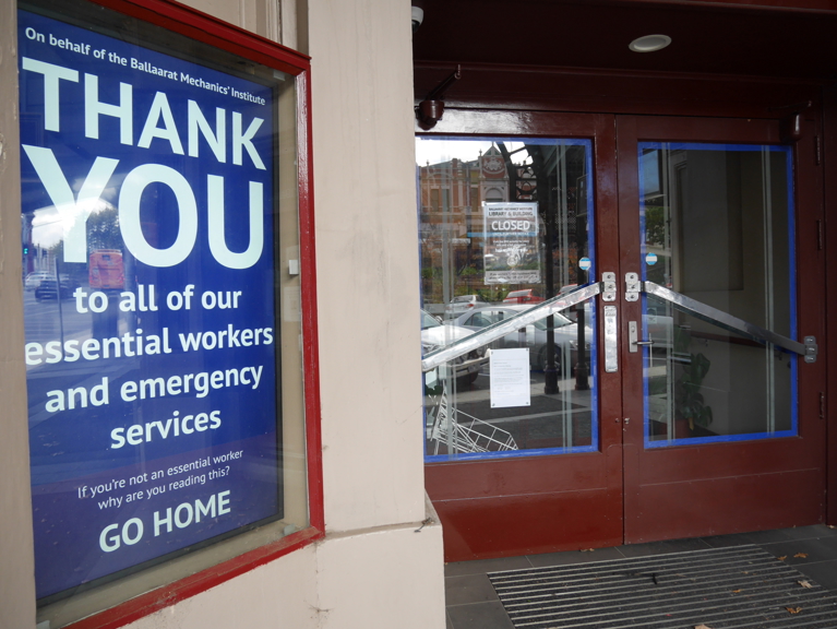 Closed storefront with signs