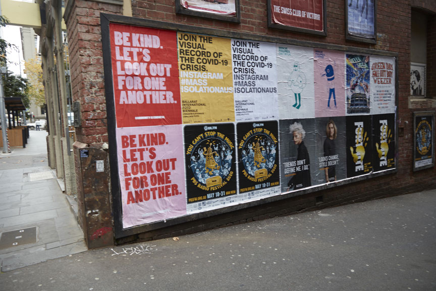 Posters on a brick wall