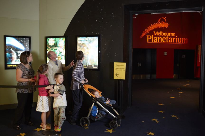 Family lining up for the Melbourne Planetarium 