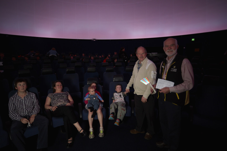Audience in Melbourne Planetarium with volunteer