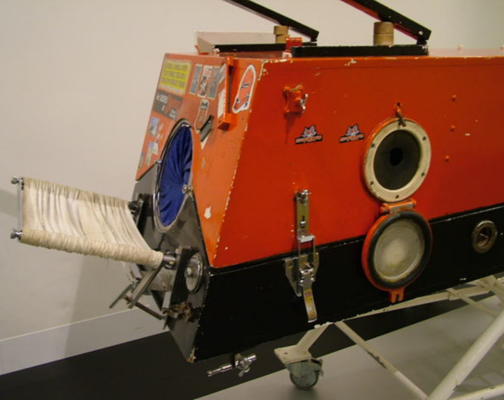 A red and black full body respirator. 