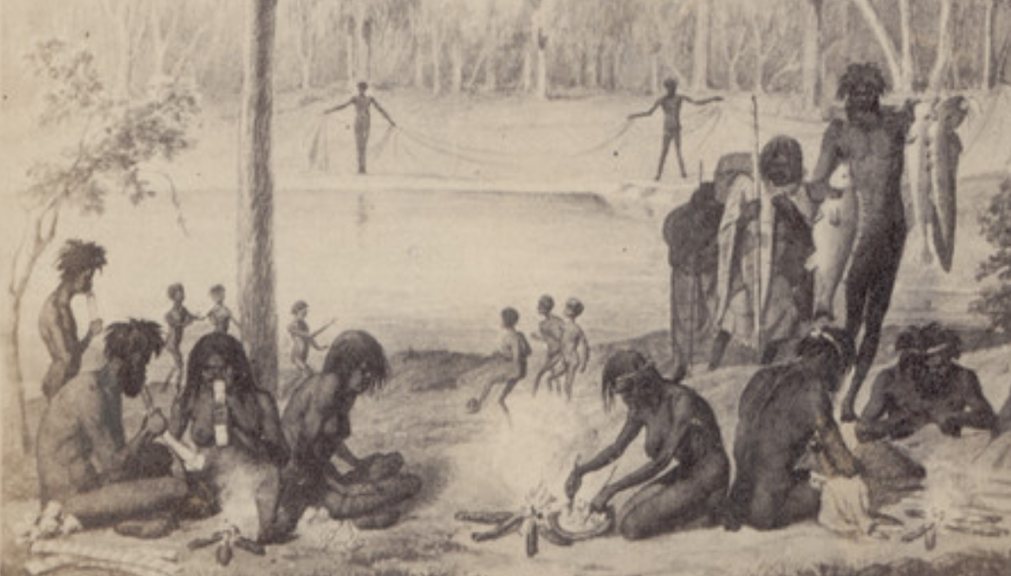 A First Peoples encampment with kids playing footy in the background. 