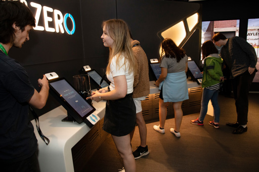 Teenager using the console to register their interactive tag for the Road To Zero educational program