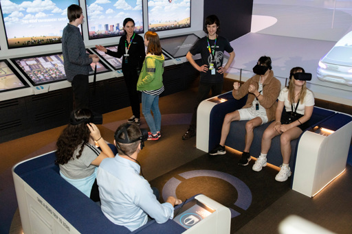 Teenagers engaging with the Road To Zero interactive displays