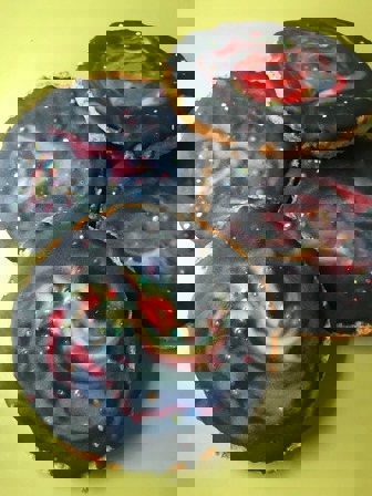 Biscuits with black icing with swirls of colour