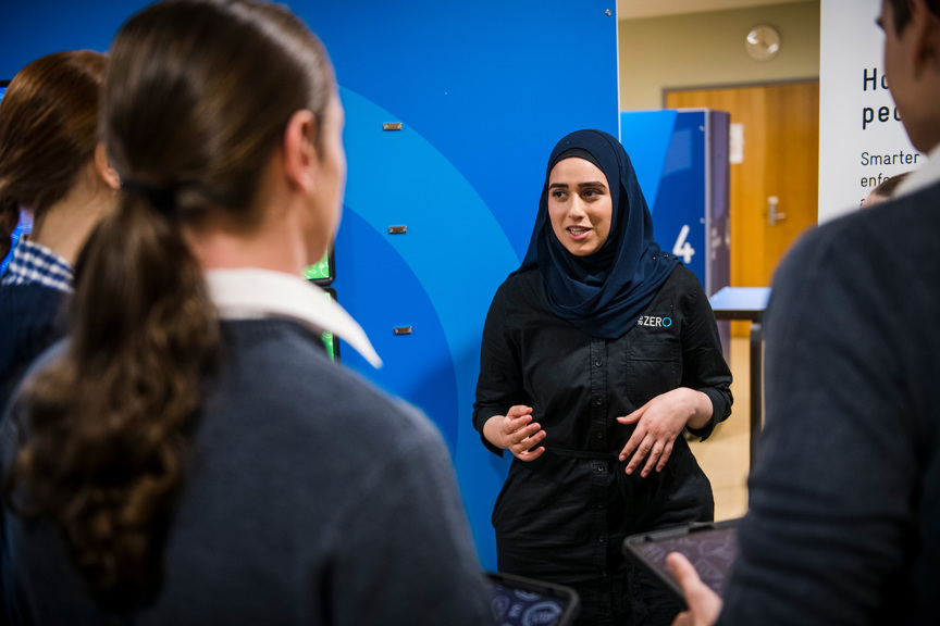 A Road to Zero presenter addressing three students