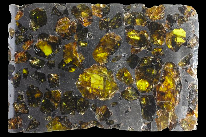 A rock filled with green crystals. 