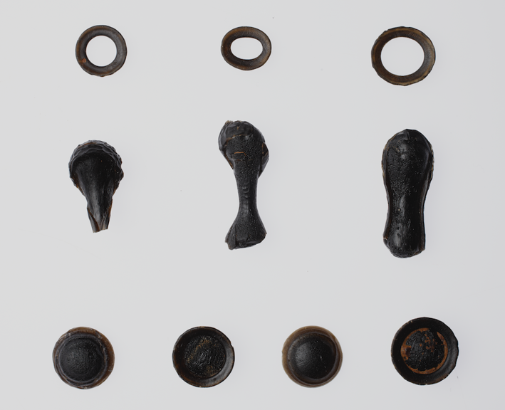 An array of oddly shapped black rocks. 