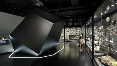 Mother and children examine the Geoscience collection showcases