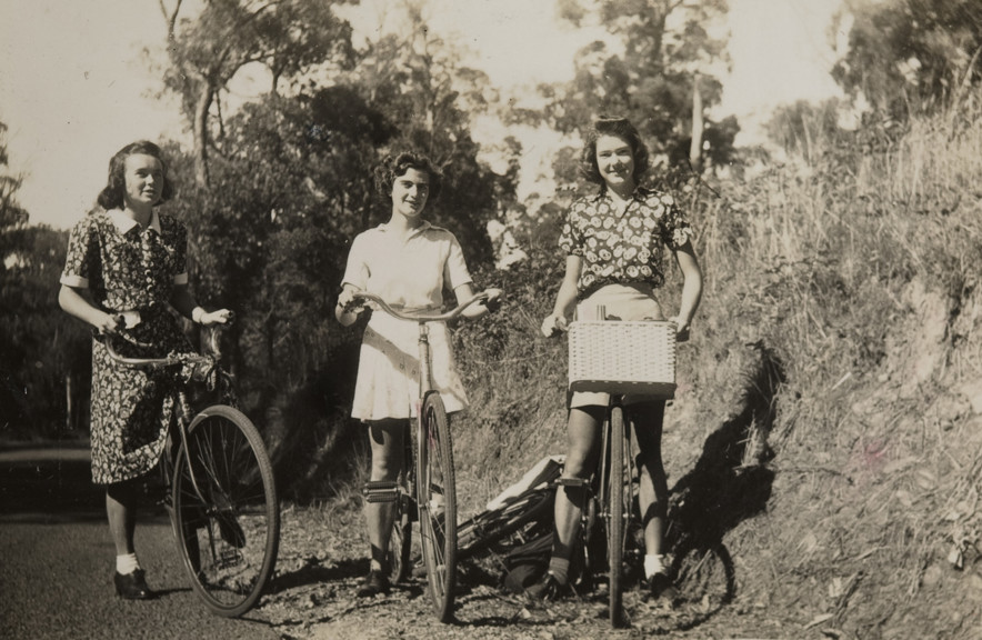 Three girls riding their bikes to Ferntree Gully, 1940.