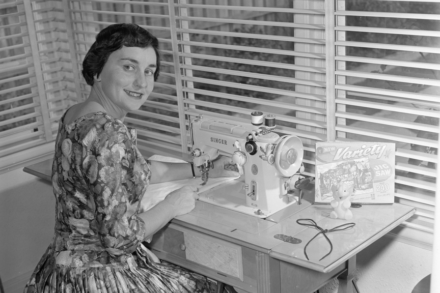 Portrait of Mrs Andrews using a sewing machine at Ashburton.