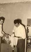 Ugo Ceresoli and his brother Bruno Ceresoli washing up in the kitchen of the boarding house at 230 Palmerston Street, Carlton, where they rented accommodation