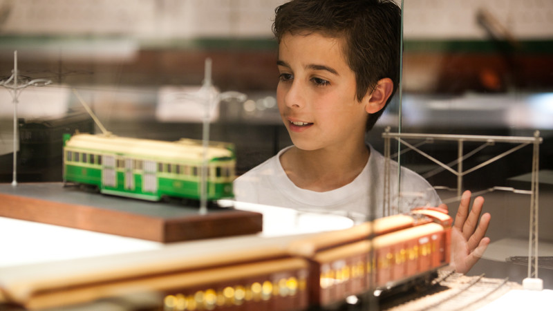 Boy looking at cable tram display