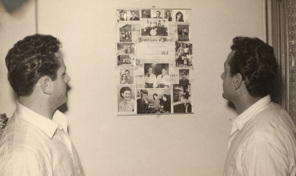 Ugo Ceresoli and his brother Bruno Ceresoli in their rented apartment, looking at family photos and a publicity poster for their appearance on 3UZ radio station, circa 1953