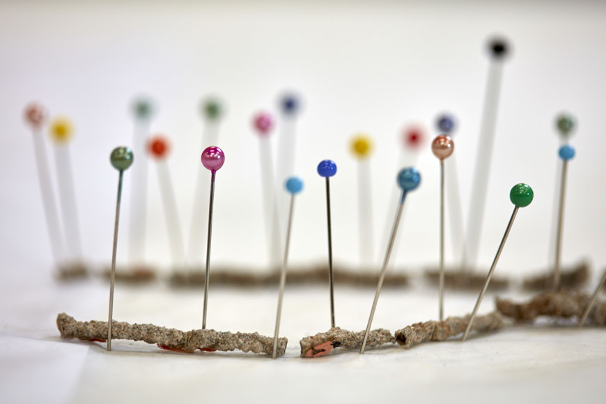 A broken fulgurite pinned in place