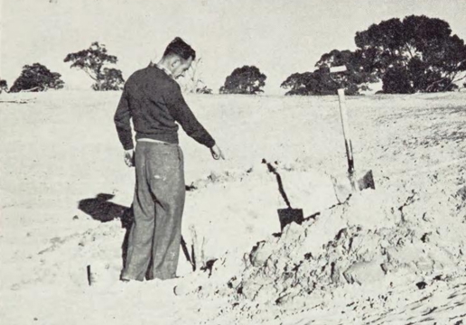 Person pointing at a hole