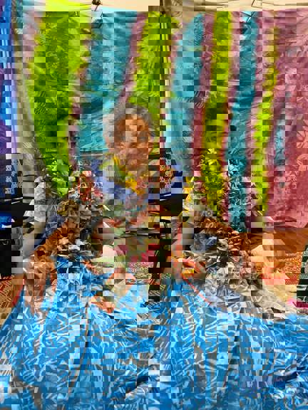 Boy with his  money lei