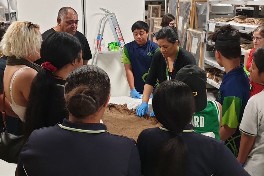 Group of students viewing collection objects