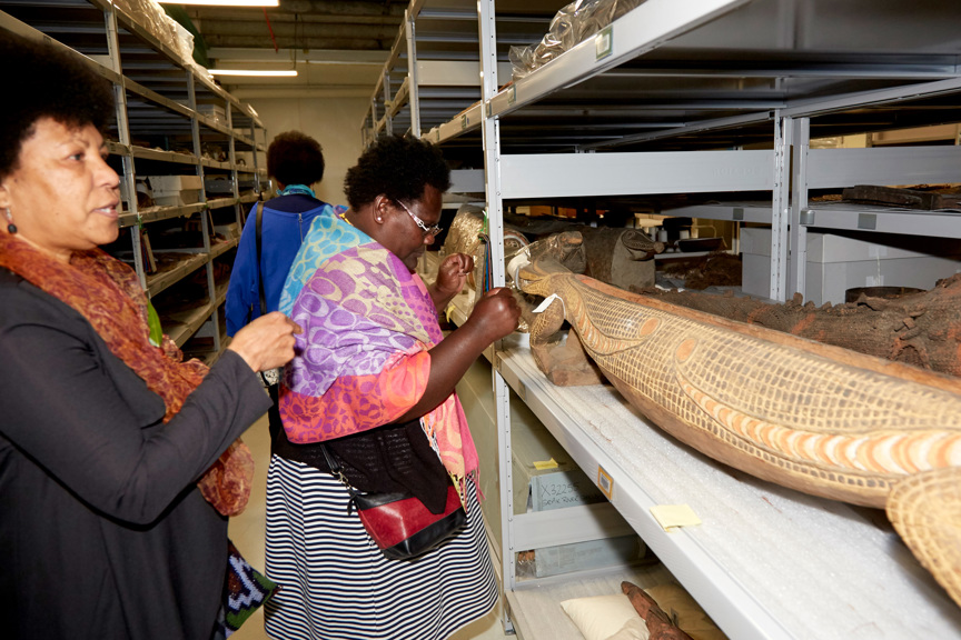 Two woman viewing collection objects in the store