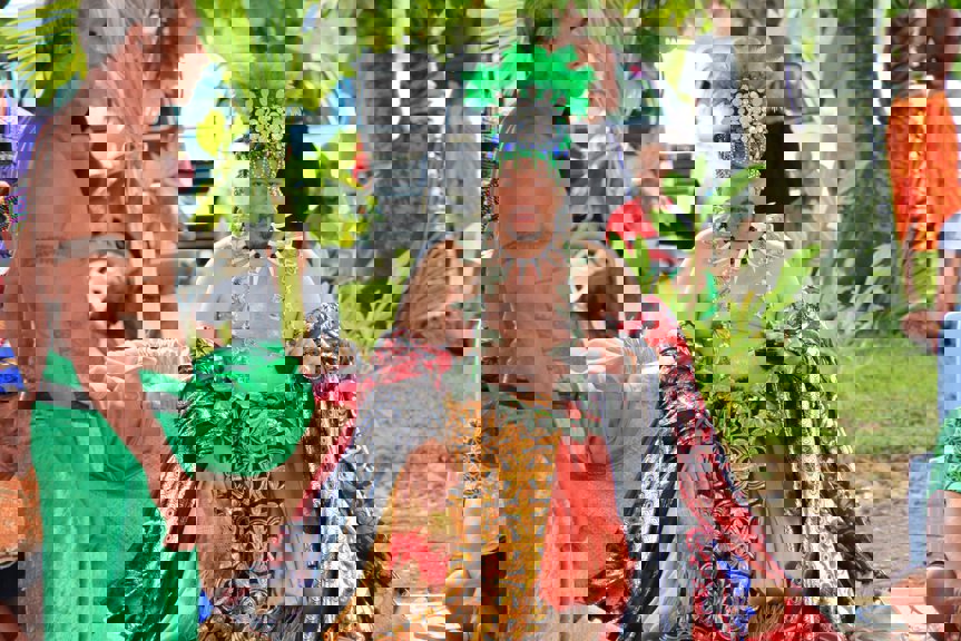 Man sitting on a wearing ceremonial costume