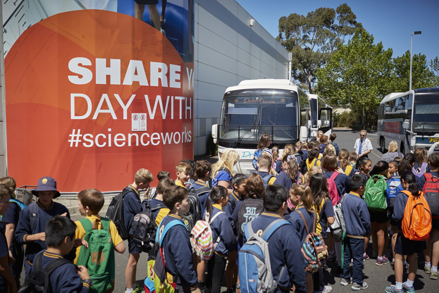 Schoolchildren walking towards a bus