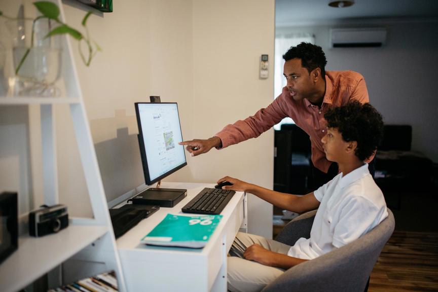Man and boy using a computer
