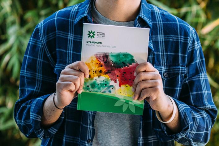 Detail of a man holding a book