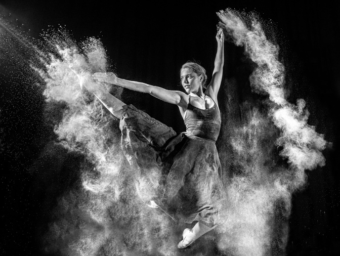 A dancer strikes an athletic pose