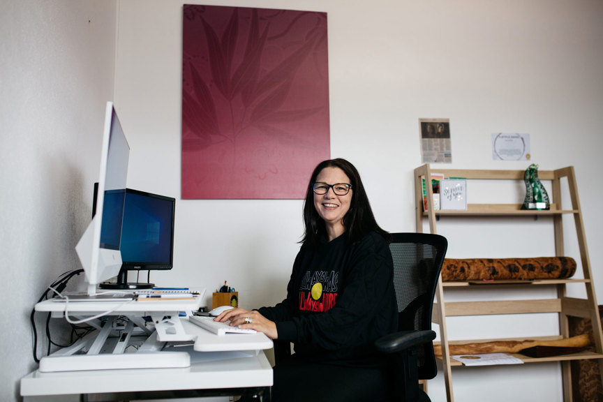 Woman sitting a  her desk
