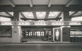Kodak exhibition stand. X-Ray images displayed throughout, with chairs and medical imaging equipment arranged around the space.