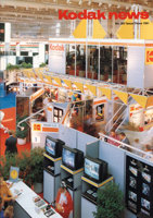 A view from above showing a Kodak exhibition display. There are television sets amongst bright yellow and red graphics