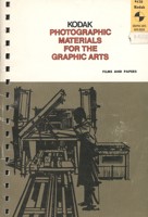 Cover of a paper booklet. There is an illustration of a person using a printing press. The colour scheme is white, brown and black