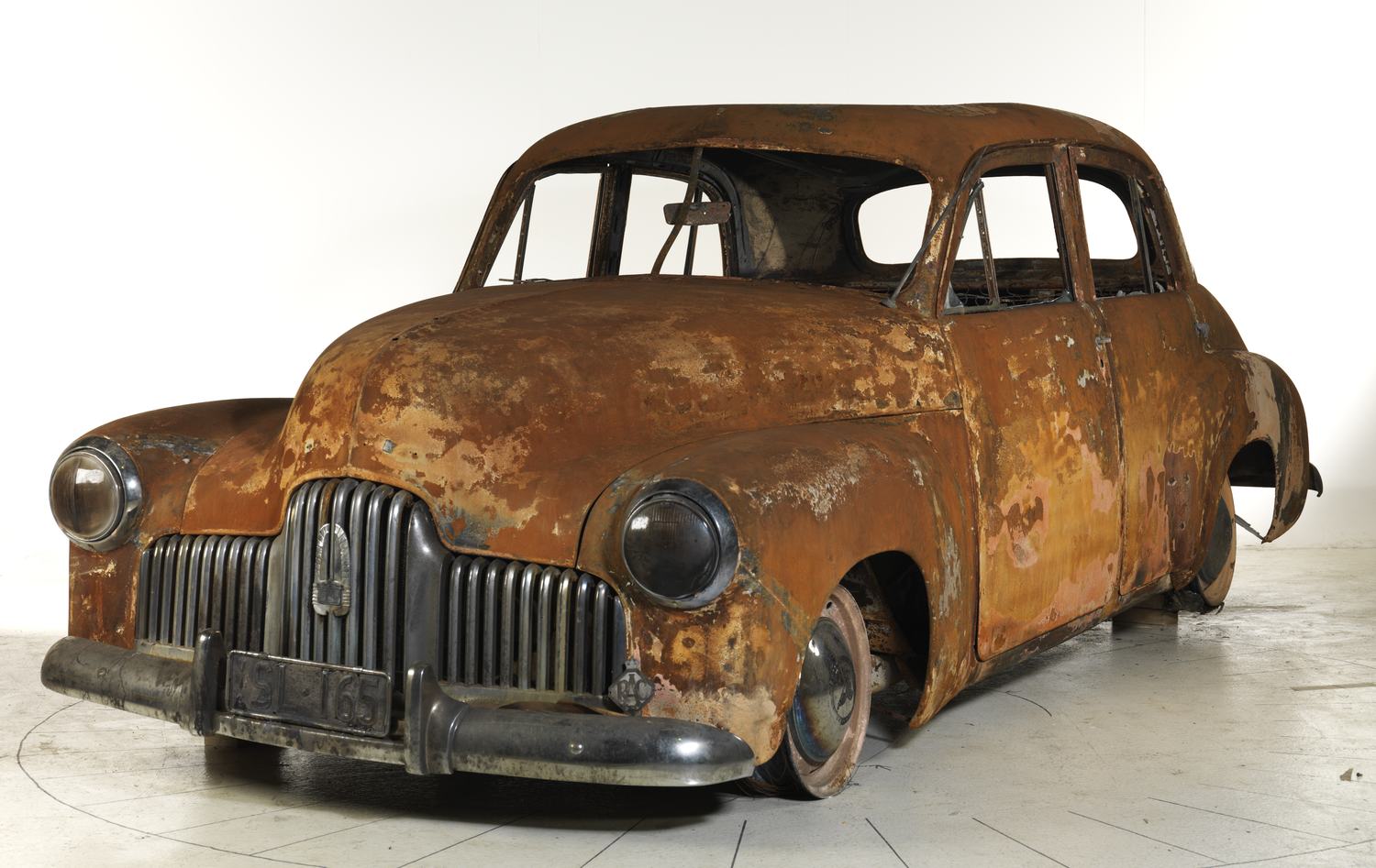 Fire damaged vintage Holden car.